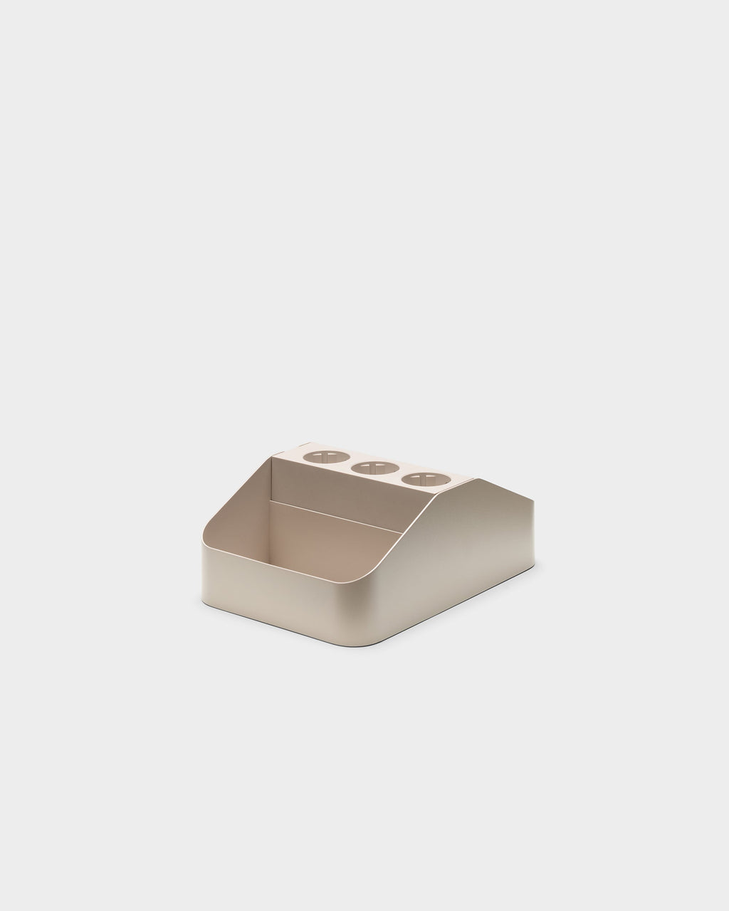 Angled studio view of the oat Power Bar Tray Double showing three round outlet cutouts and open storage compartment