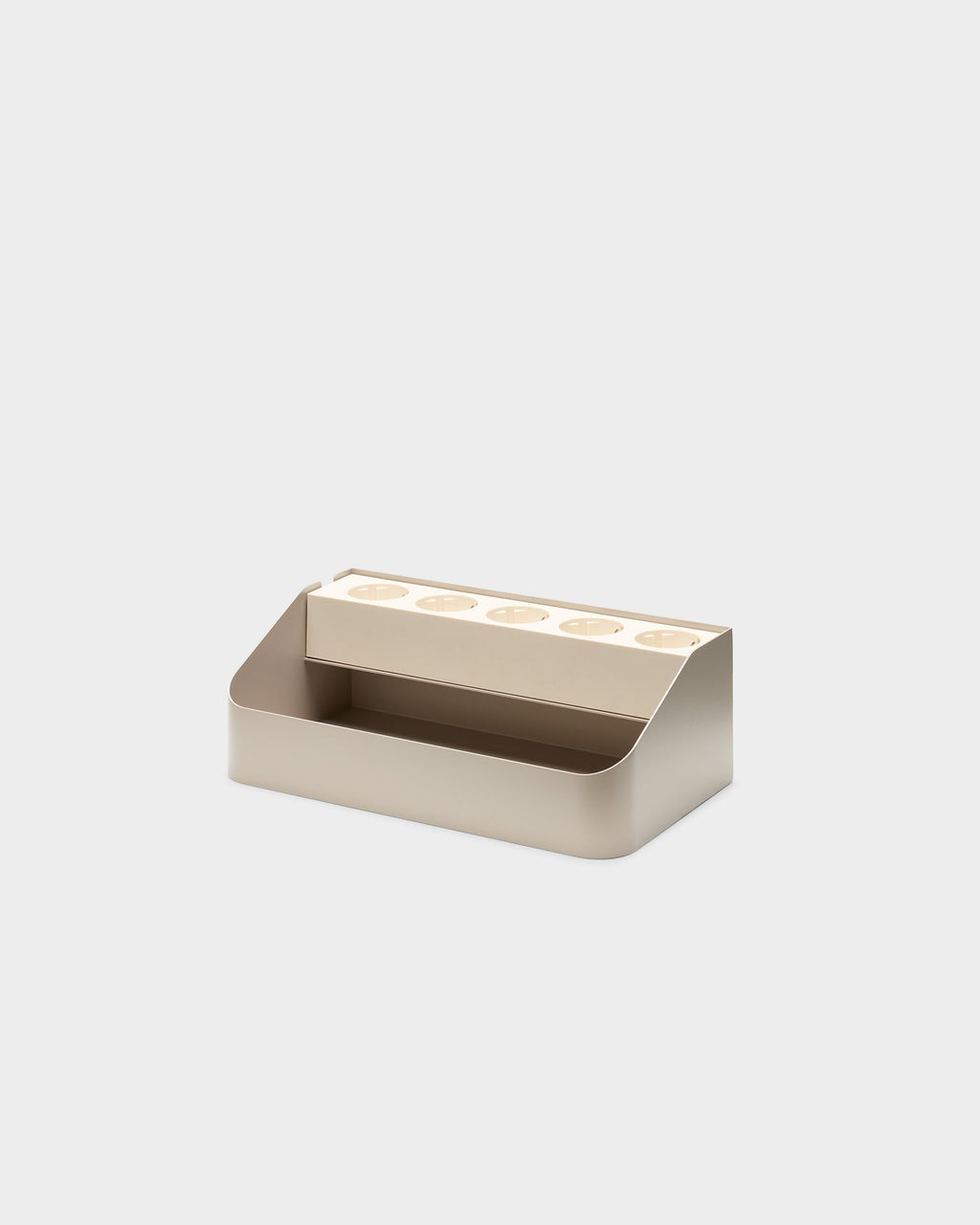 Angled studio view of the Power Beam Tray in Oat, showing five recessed outlets set into its open cable-storage bin