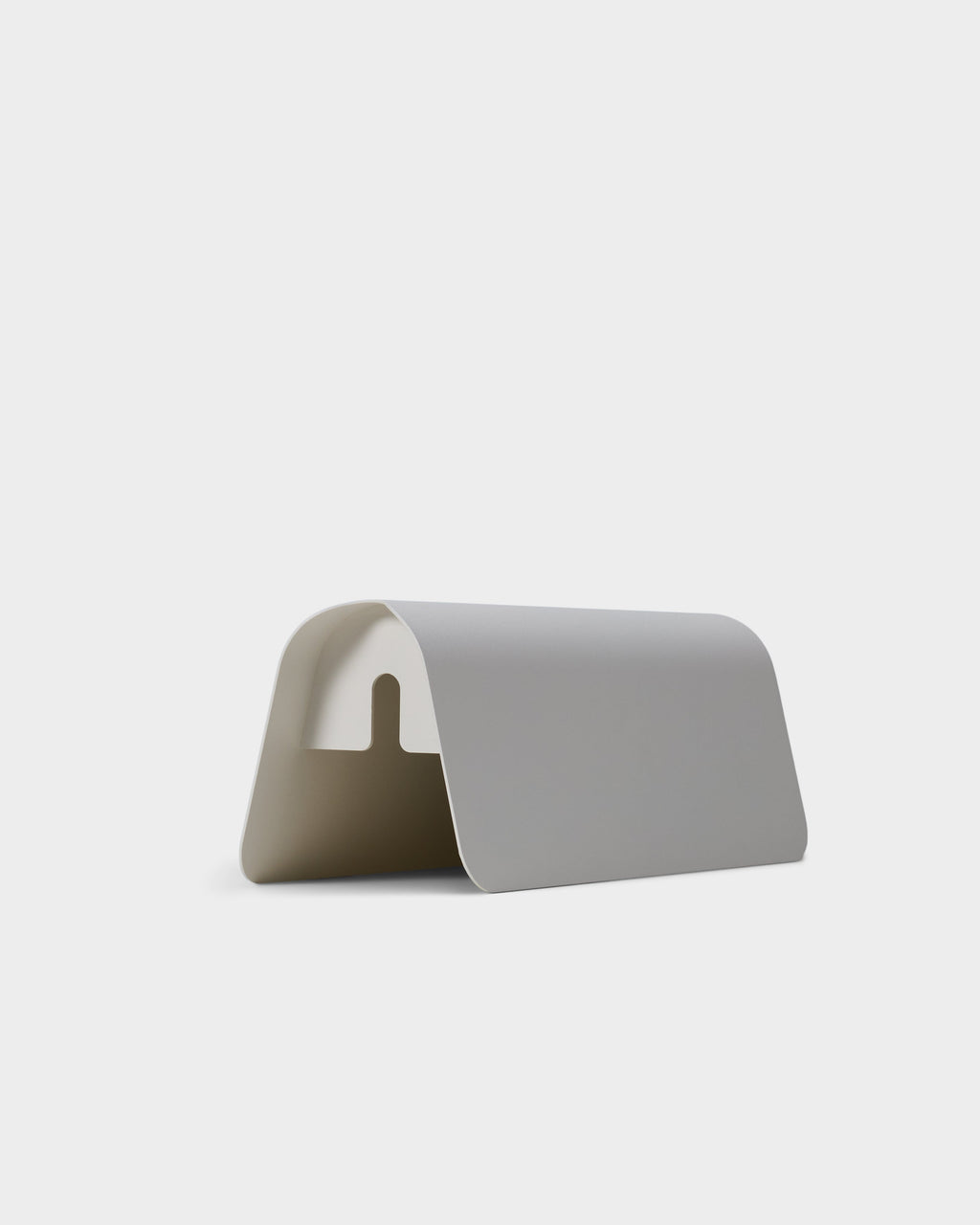 Angled studio packshot of the Power Shell in Pearl, showing its curved arch form and notched cord cutout opening