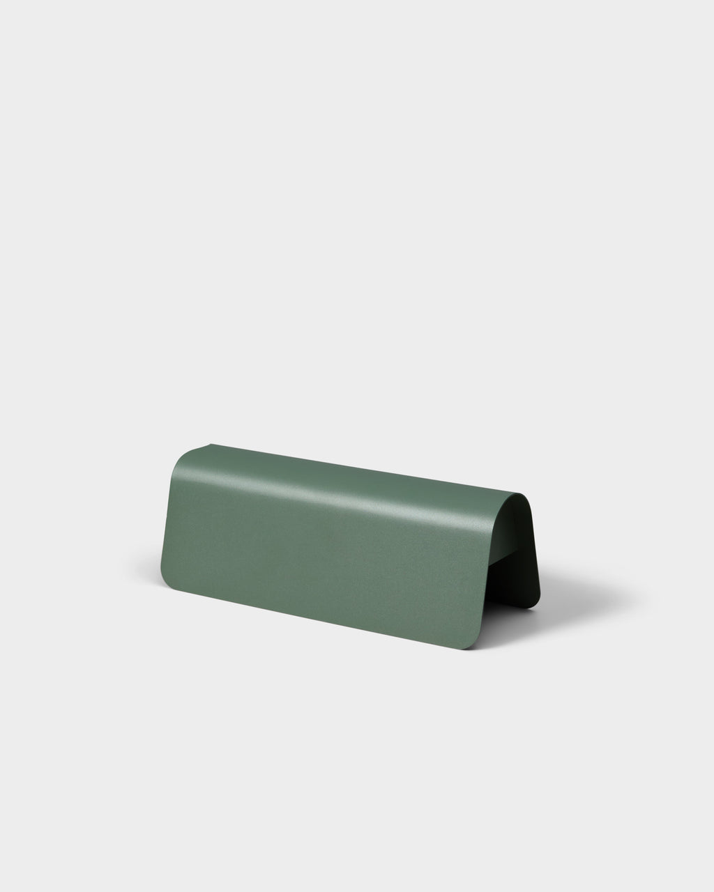 Power Shell in Mossy Green shown at an angle in a studio packshot, curved metal cover concealing cords beneath