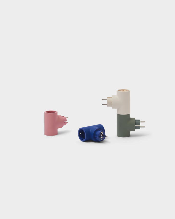 Power Split in Mossy Green shown upright with cream, pink and blue splitters in a light studio packshot group
