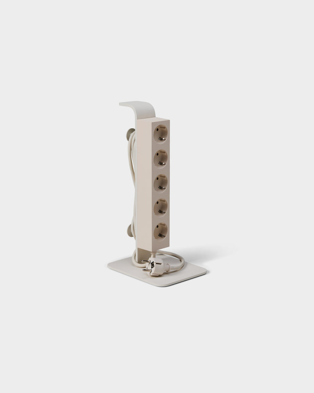 Angled studio view of the Pearl Power Tower, five upright sockets, coiled cord and plug on a flat square base