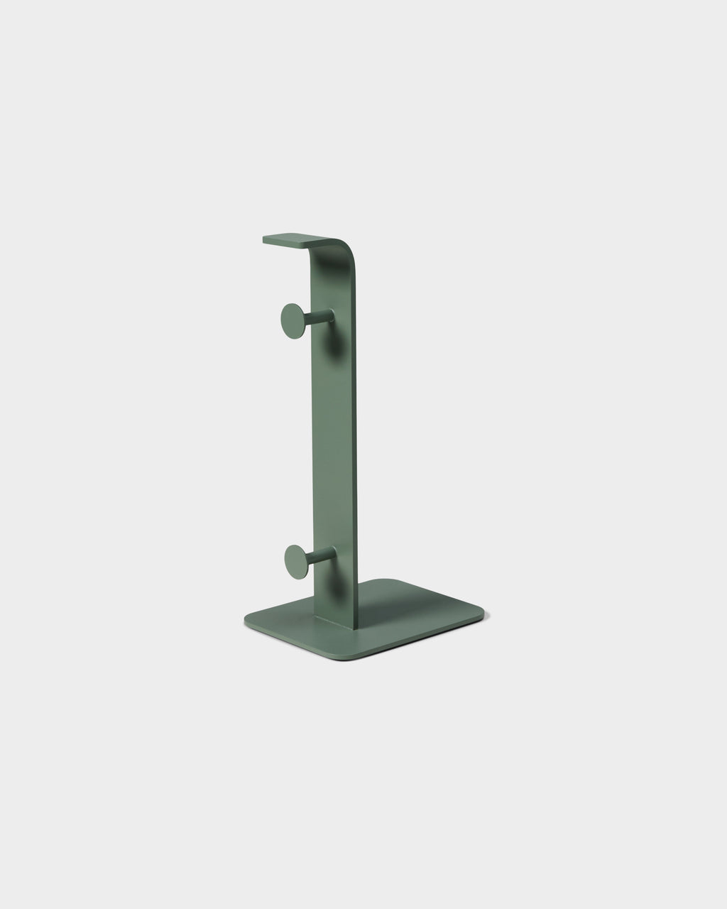 Mossy Green Power Tower studio packshot, angled view of curved metal stand with two peg hooks and square base