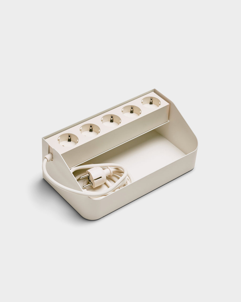 Power Beam Tray in Pearl shown at an angle, five-socket strip with coiled cord tucked in the open cable tray