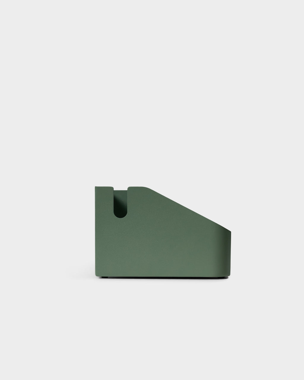 Side profile studio packshot of the Power Beam Tray in Mossy Green, showing its sloped wedge shape and cable notch