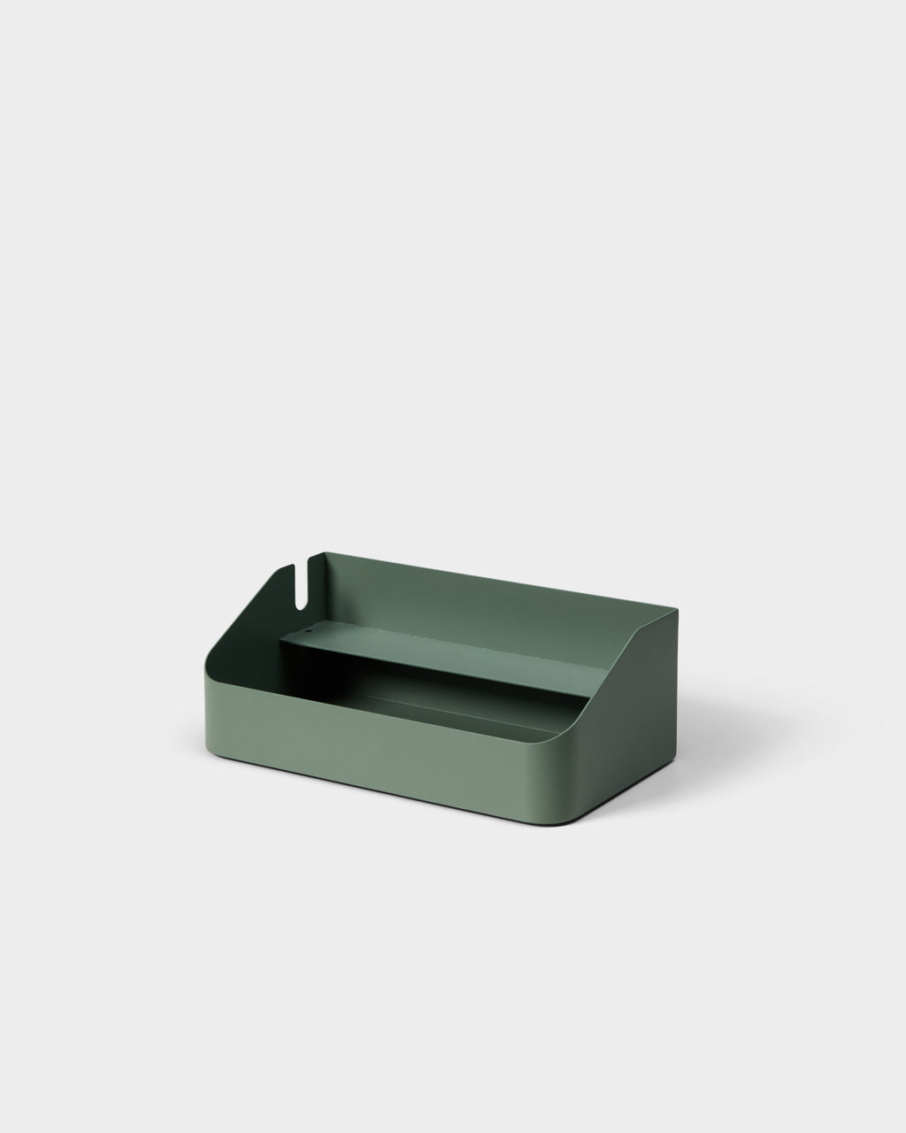 Power Beam Tray in Mossy Green shown at an angle in a studio packshot, revealing its open cable-management shelf