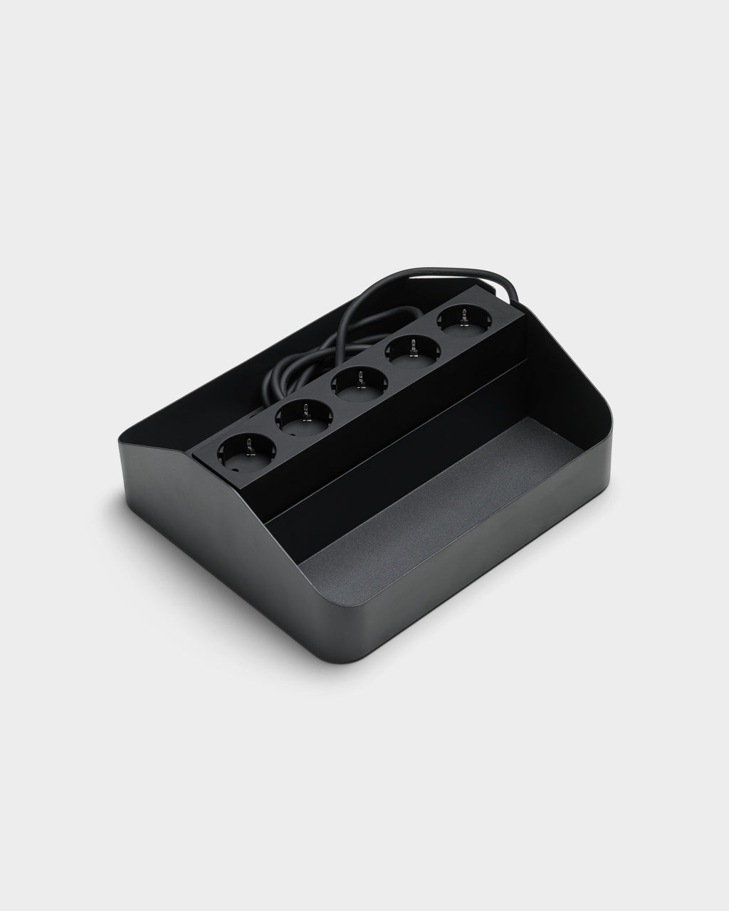 Angled studio packshot of the Power Beam Tray Double in Charcoal, showing five recessed sockets and coiled cable storage