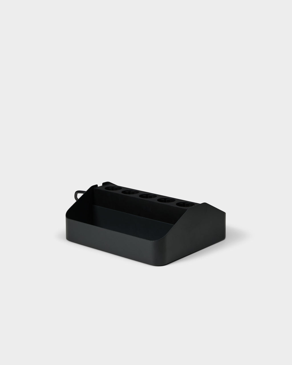 Angled studio view of the charcoal Power Beam Tray Double, showing five outlet slots and open cable storage bin