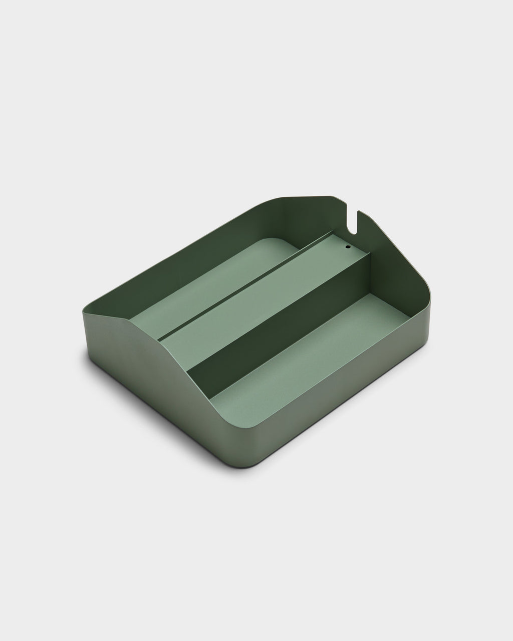 Angled studio packshot of the Power Beam Tray Double in Mossy Green, showing its divided metal interior and cable notch