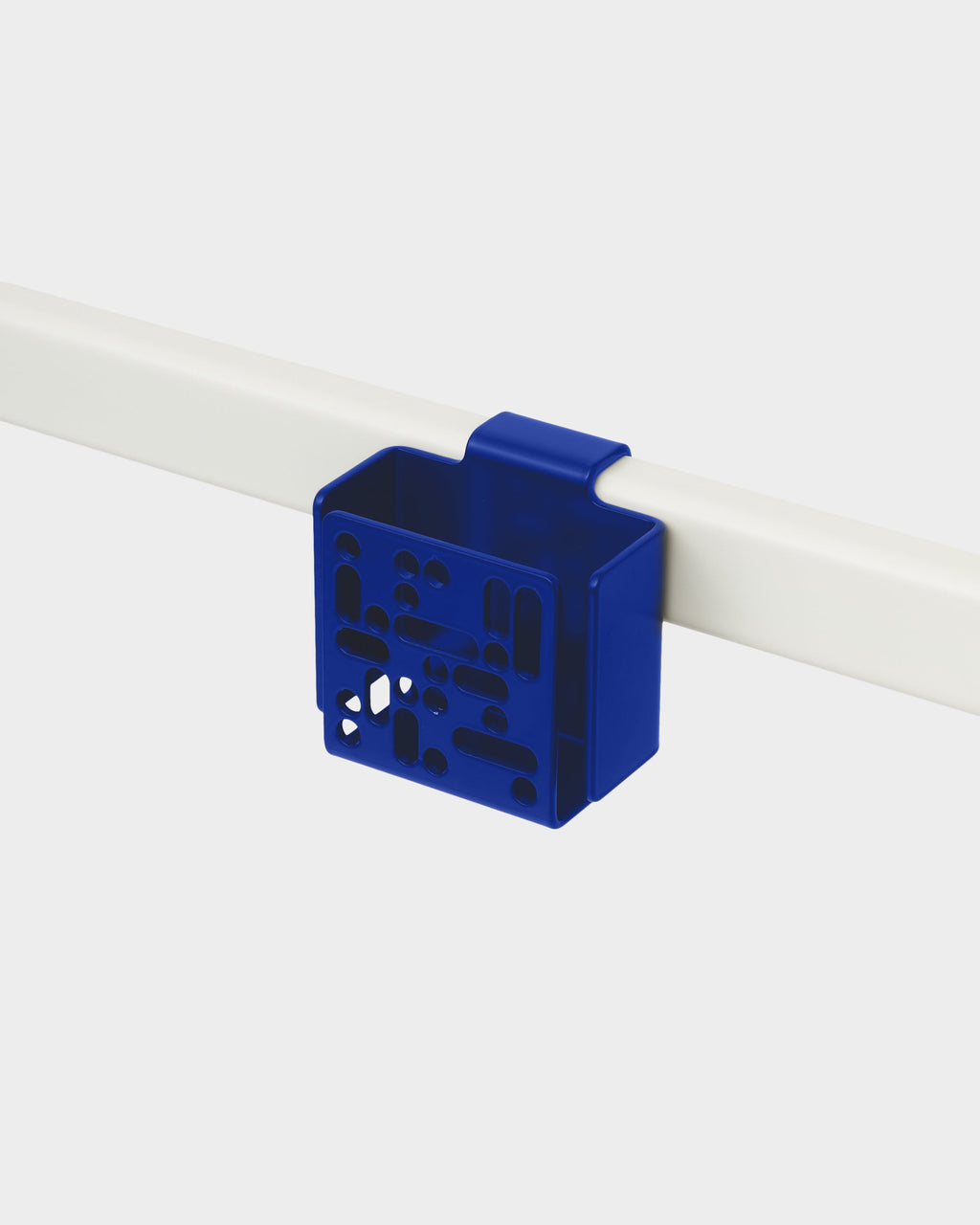 Ultra Marine Remote Box Mount clipped onto a white rail, studio packshot angled to show perforated front panel