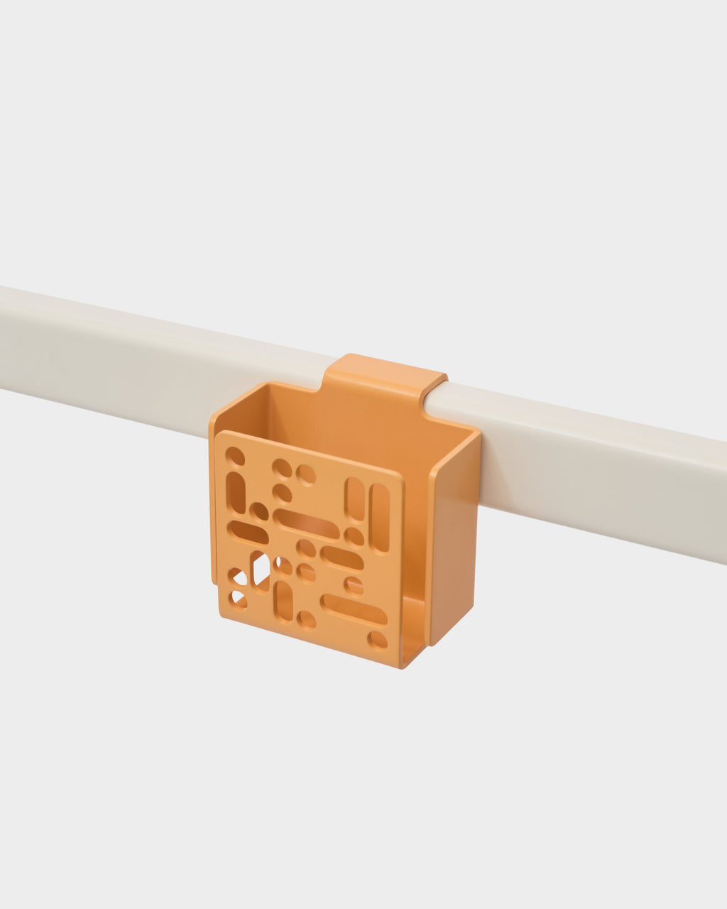 Apricot Remote Box Mount clipped onto a light rail, angled studio view showing perforated front panel