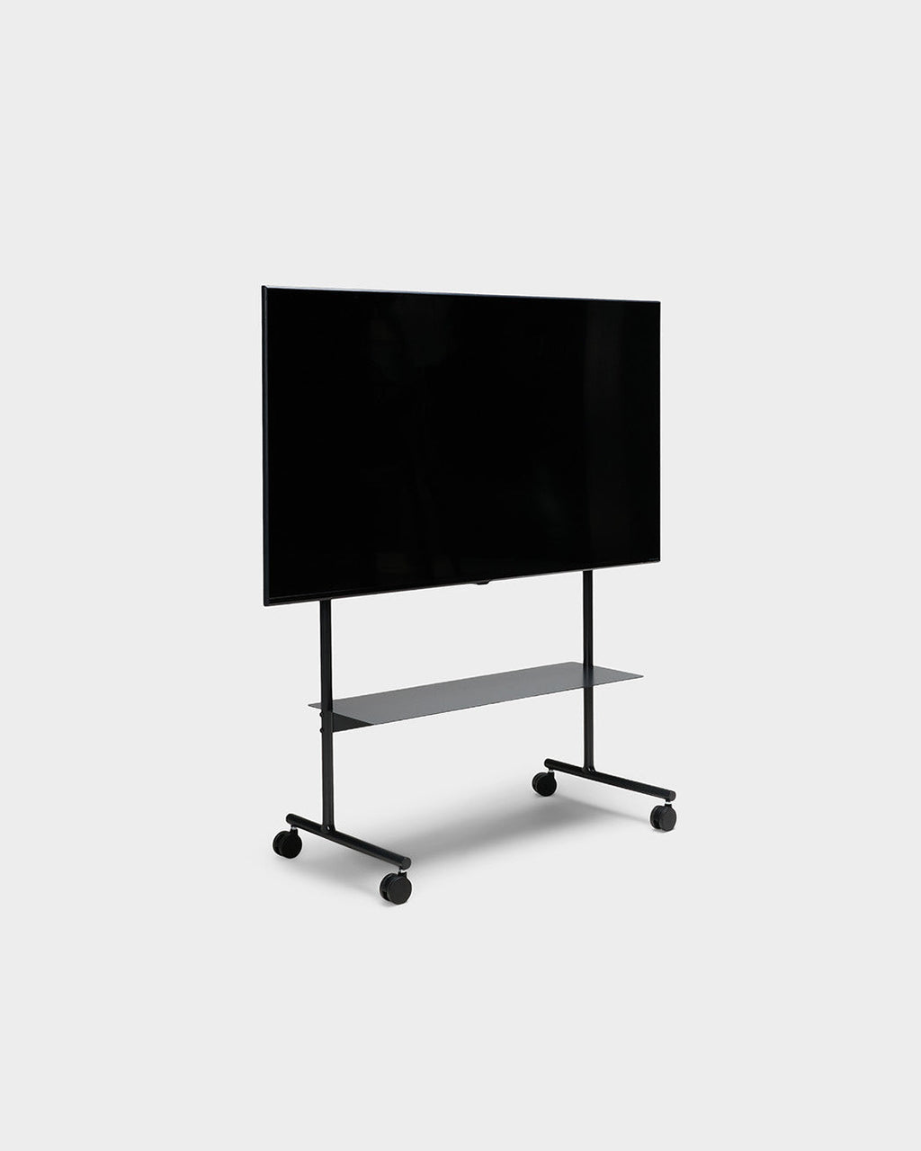 Rover charcoal rolling TV stand with mounted flat-screen, shelf and locking casters, angled studio view on grey backdrop