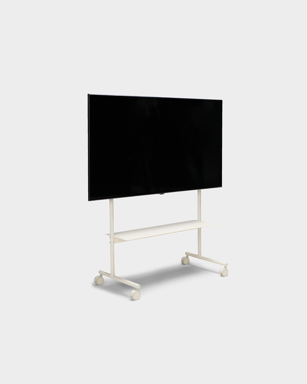 Rover TV stand in Pearl shown at an angle in studio, holding a large flat-screen TV above a shelf on lockable wheels