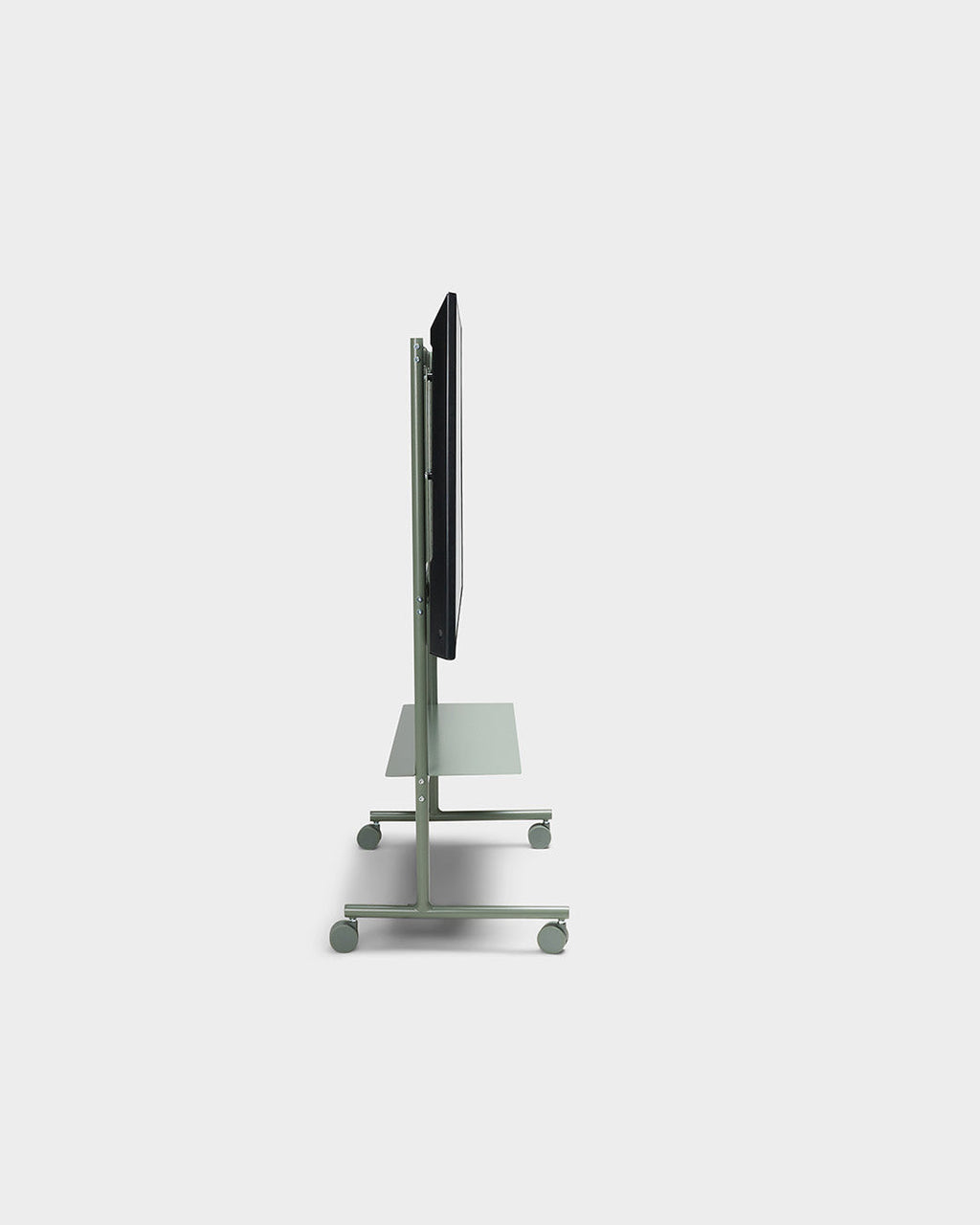 Side profile studio view of the Rover TV stand in Mossy Green with mounted flat screen, shelf and four caster wheels