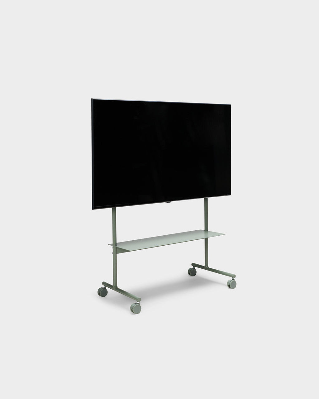 Rover mobile TV stand in Mossy Green shown at an angle in studio, holding a large flat screen above a shelf and casters