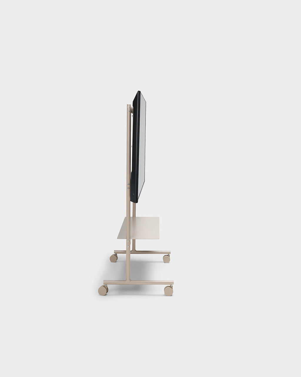 Side profile studio view of the Rover stand in Oat with mounted TV, shelf and four caster wheels