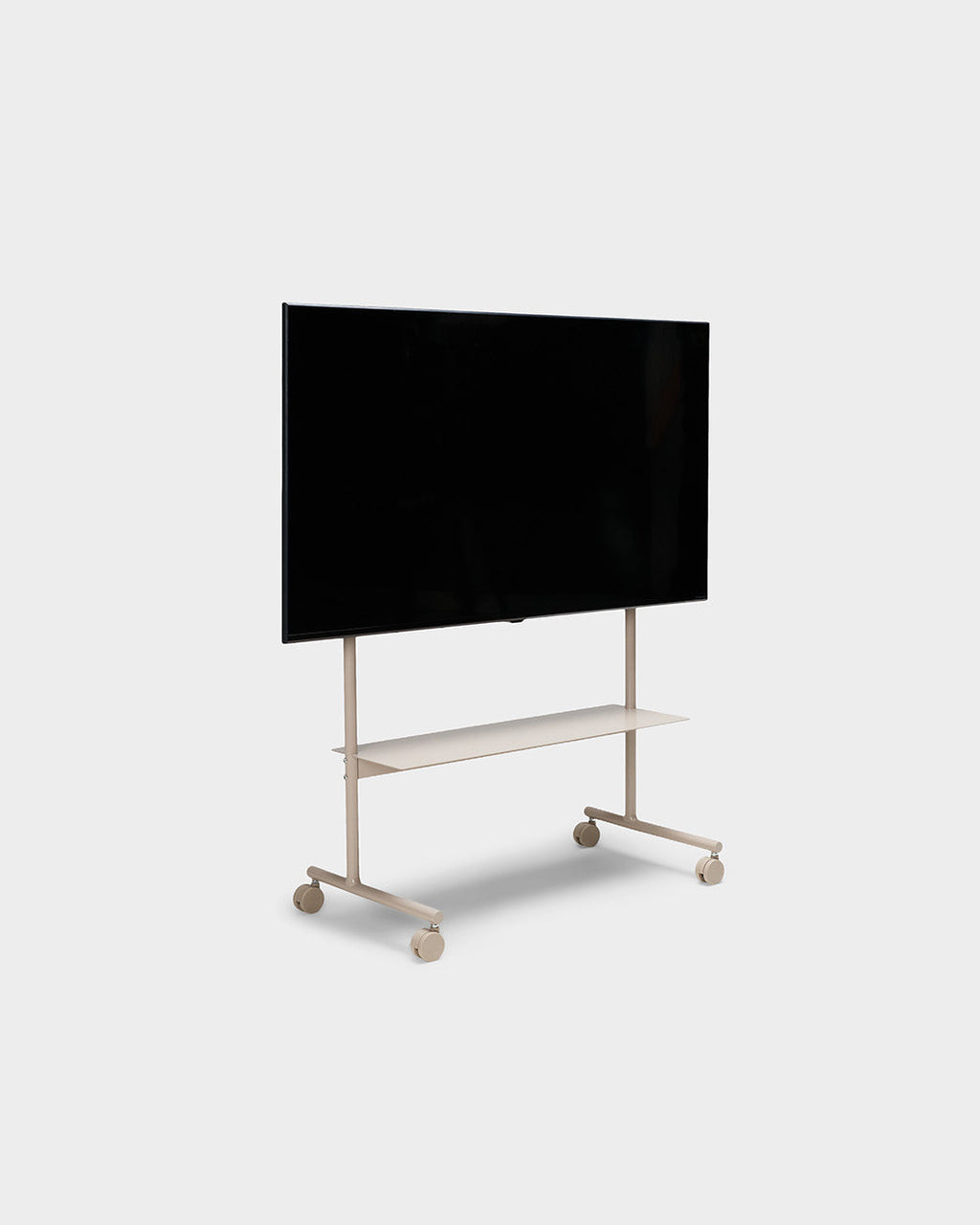 Rover TV stand in Oat shown at an angle in a studio packshot with mounted flat-screen TV, shelf and rolling wheels