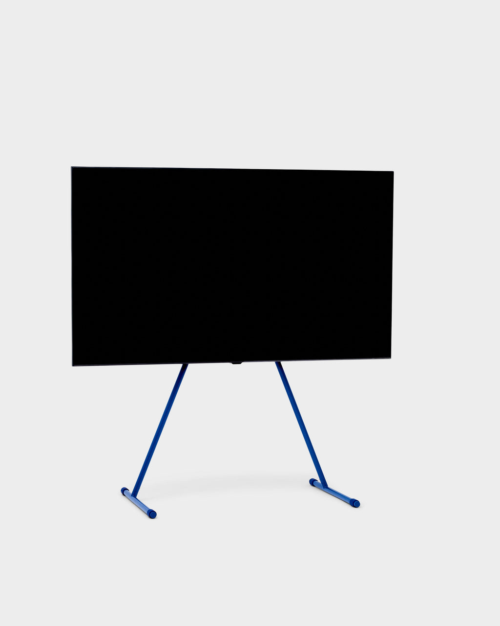 Viva TV stand in Ultra Marine holding a large flat-screen TV, angled studio packshot on light grey background