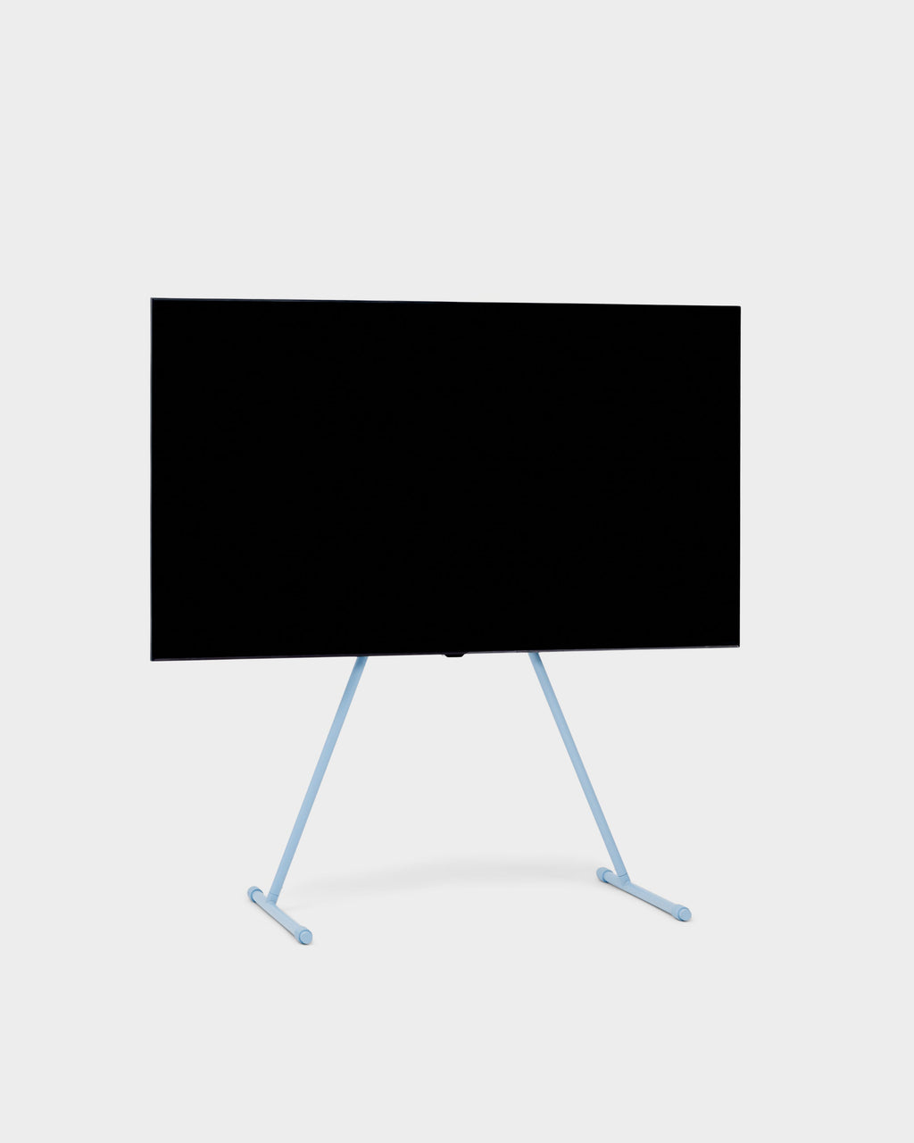 Viva TV stand in Powder Blue holding a large flat-screen TV, angled studio packshot on a light grey background