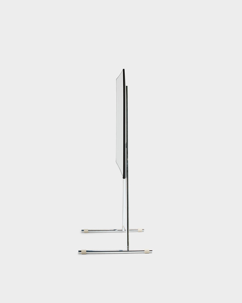 Side profile studio packshot of the Viva TV stand in chrome, showing its slim upright post and twin crossbar feet